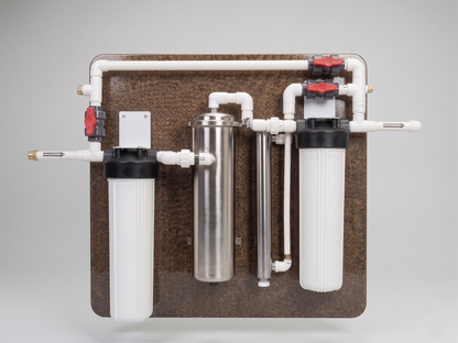 Water filtration system with multiple cylindrical filters on a gray background