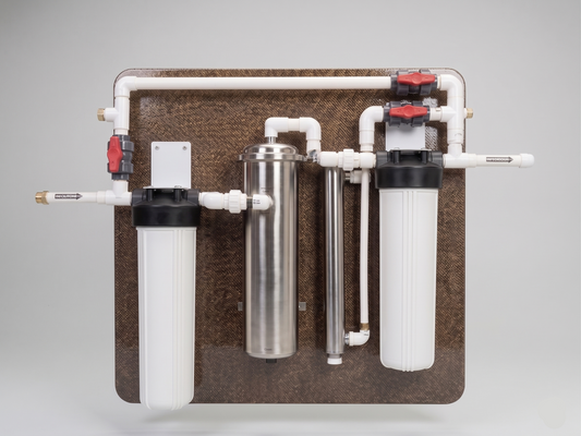 Water filtration system with multiple cylindrical filters on a gray background